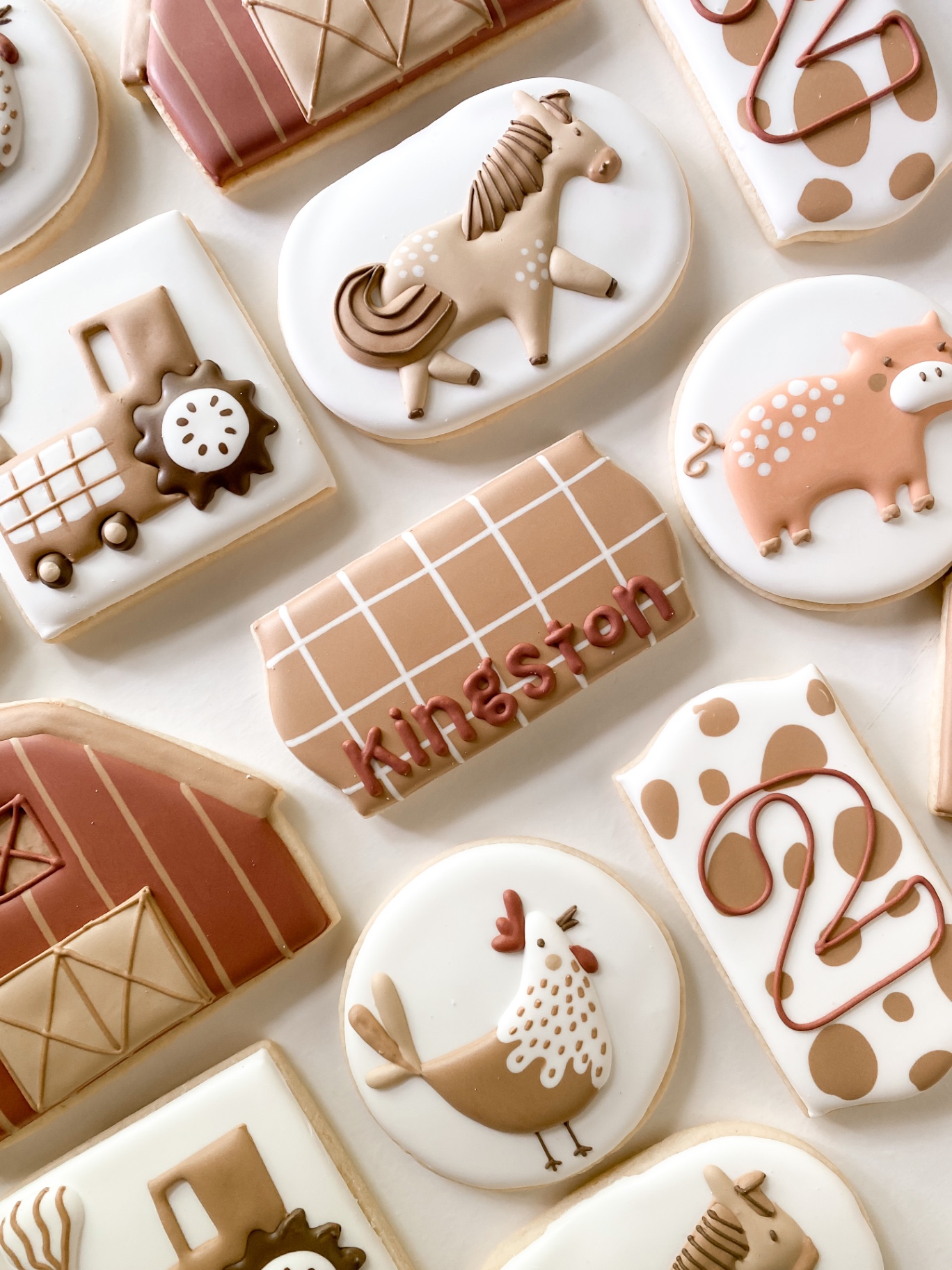 Farm animal birthday cookies in warm earth tones