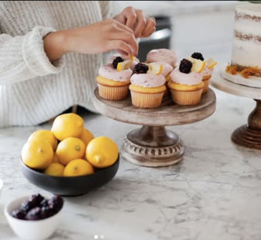 Lemon cupcakes on a wooden cake stand