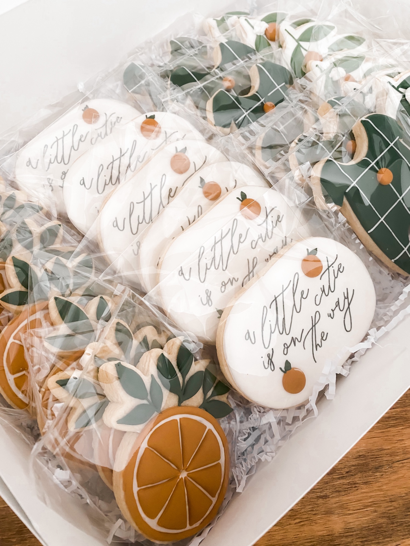A little cutie is on the way citrus-themed baby shower cookies